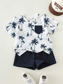 Babylove Nauru baby boy 2-piece beach outfit with white coconut tree print t-shirt, navy pocket, and matching shorts.