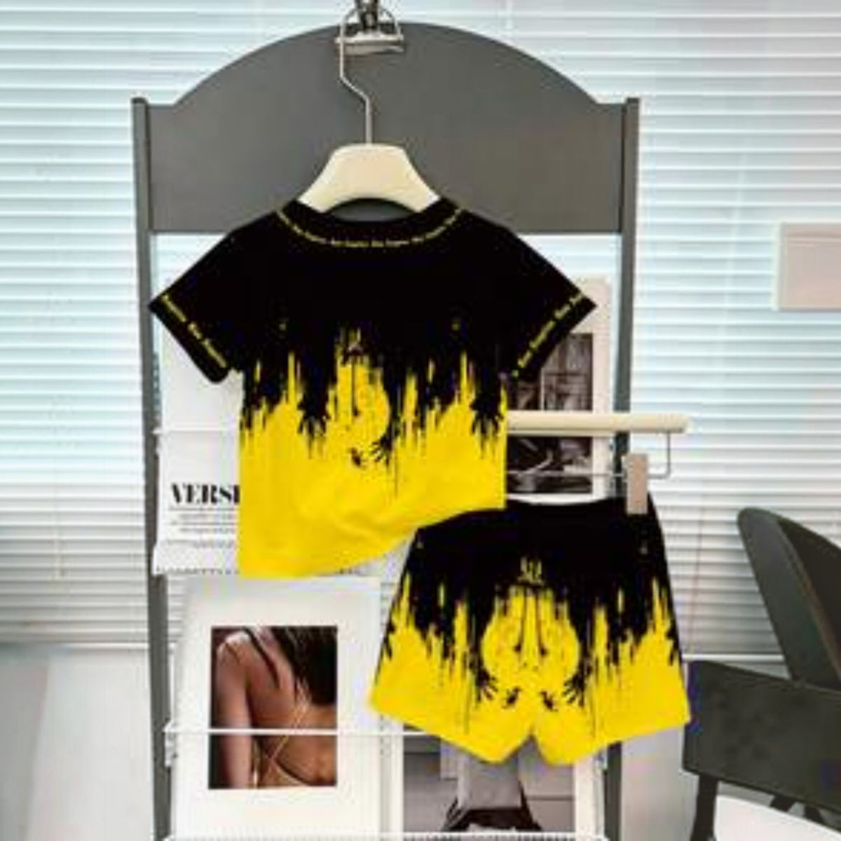 Babylove Nauru baby boy summer outfit featuring a black and yellow t-shirt and shorts with graffiti letter print.