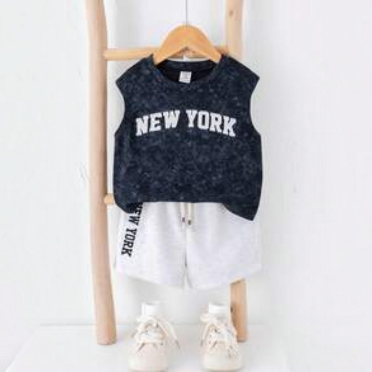 Babylove Nauru toddler boy summer outfit featuring a dark acid-wash New York vest top and light grey shorts set.