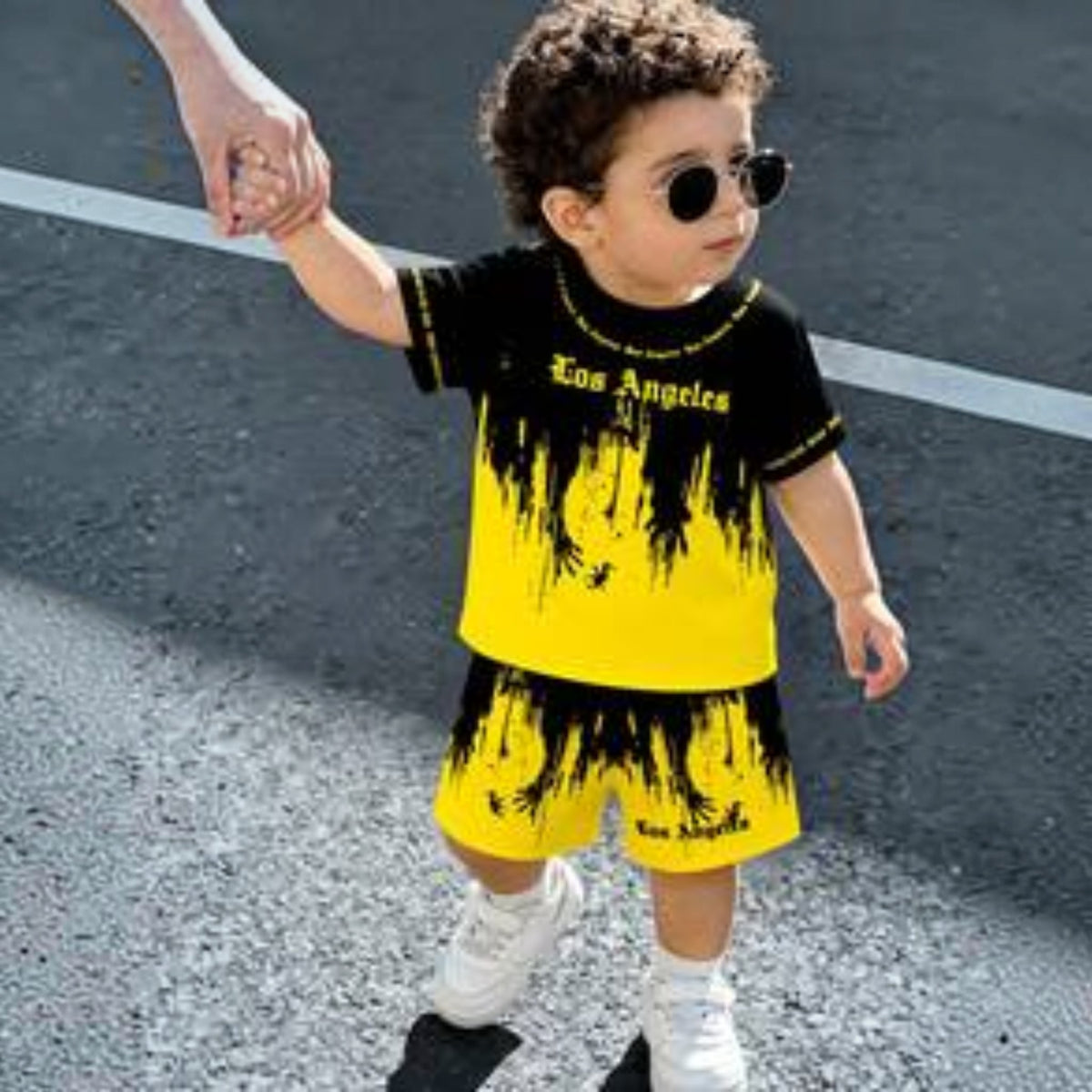 Babylove Nauru toddler boy wearing a black and yellow Los Angeles letter print t-shirt and matching shorts set