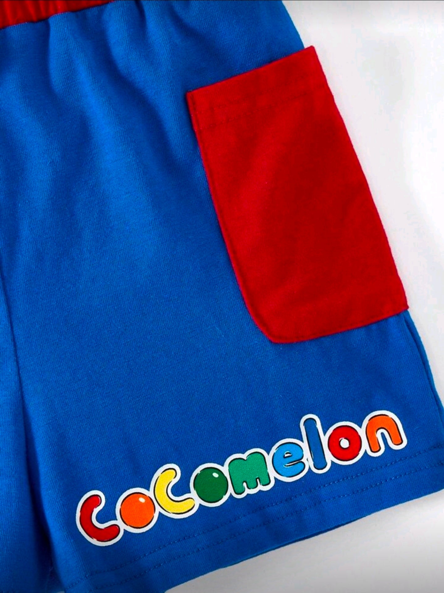 CoComelon X SHEIN 2pcs Baby Boy Cartoon Character Print Short Sleeve T-Shirt And Contrast Pocket Design Shorts 2-Piece Summer Outfit